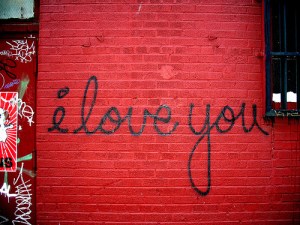 Brick wall painted with the words "I love you."