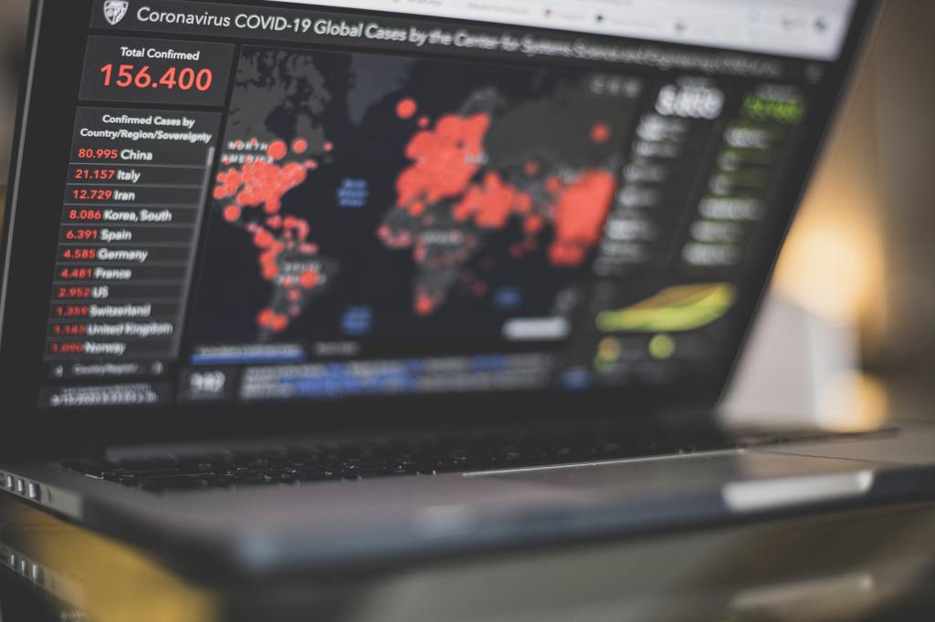 Picture of a computer screen with a COVID-19 tracker system on it. 